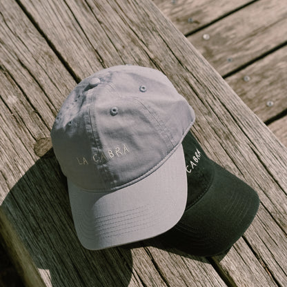 La Cabra Blue and Black caps environmental